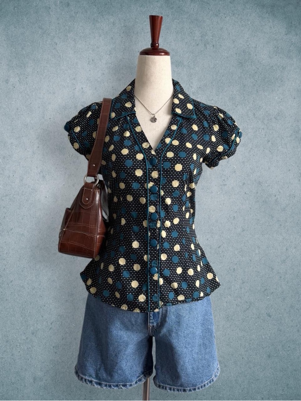 black polka dot button-up blouse - size m